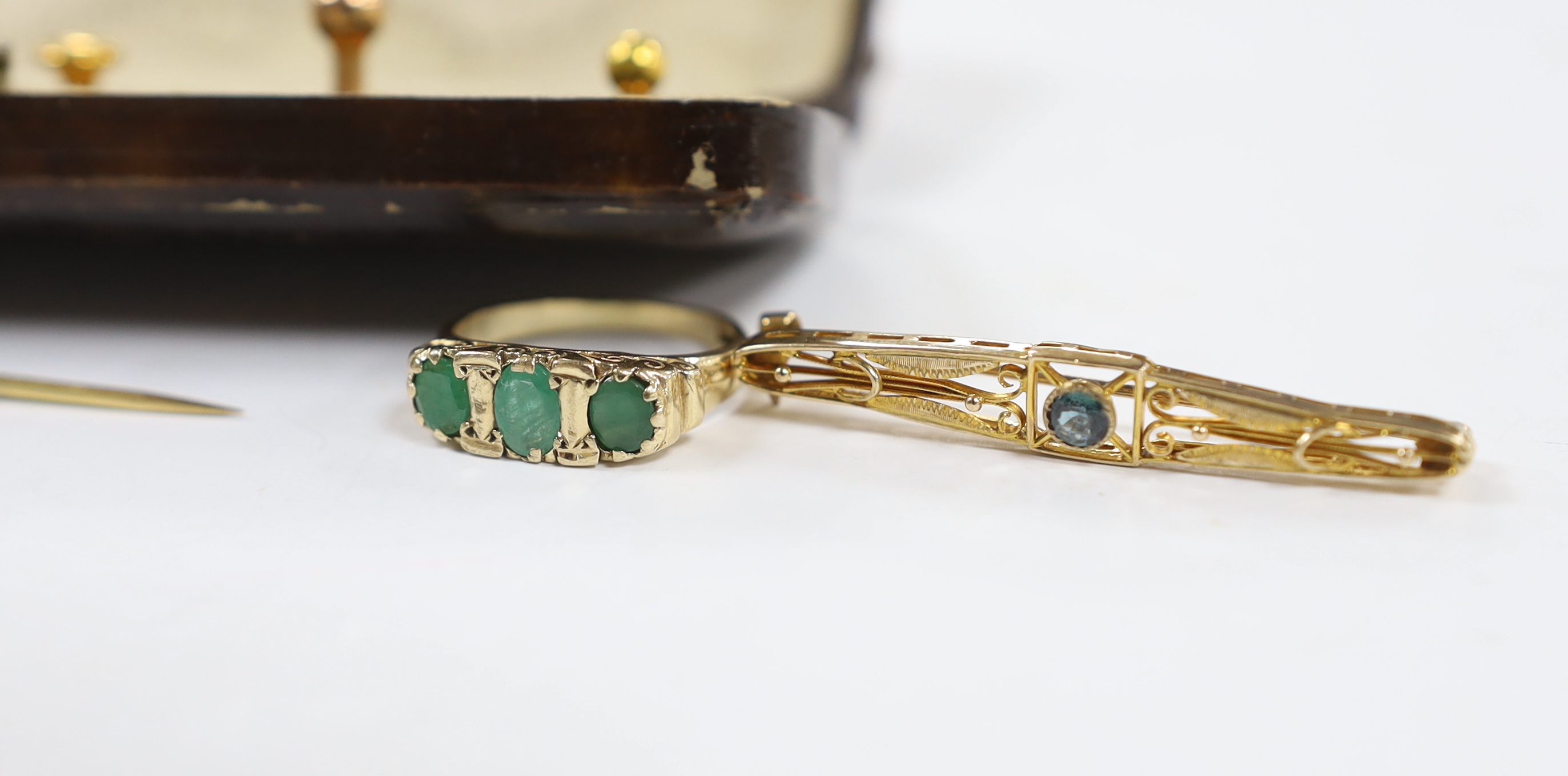 Sundry jewellery including a 14ct gold and cabochon coral set ring, a 9ct gold and gem set ring, a yellow metal and gem set bar brooch, a yellow metal and baroque pearl set stick pin and a cased five piece dress stud set